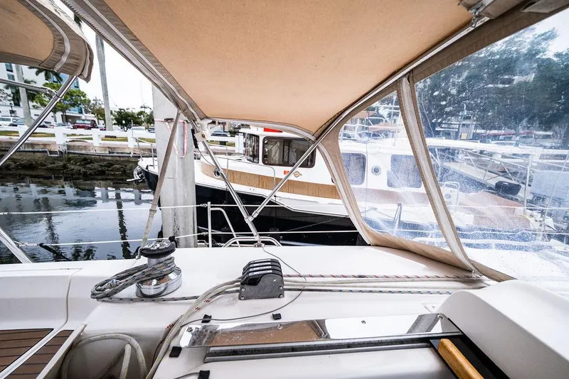 Slide: The Image of Cockpit view of a 2005 Hunter 38 sailboat docked at a marina. - 37