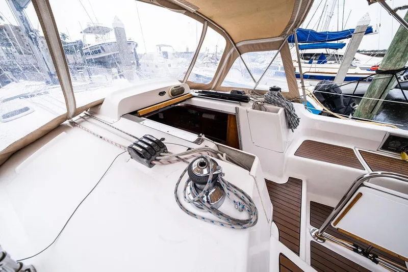 Slide: The Image of Cockpit of 2005 Hunter 38 sailboat with winch and ropes, docked at marina. - 40