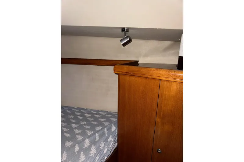 Slide: The Image of Interior cabin of 2005 Hunter 38 sailboat with wooden cabinetry and spotlight. - 59