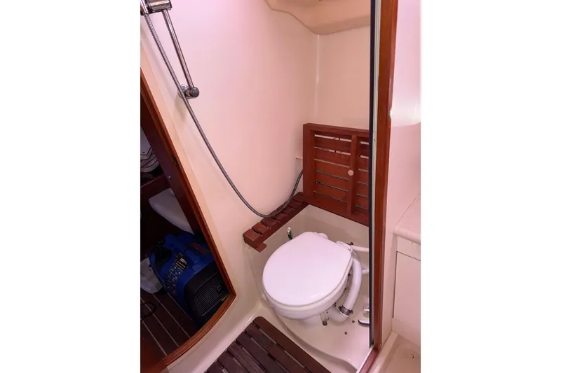 Slide: The Image of Bathroom interior of 2005 Hunter 38 yacht with shower and toilet. - 63
