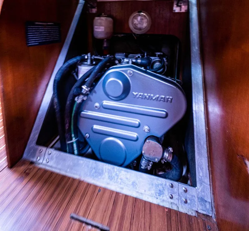 Slide: The Image of Yanmar engine inside a 2005 Hunter 38 sailboat, showcasing its compact design. - 69