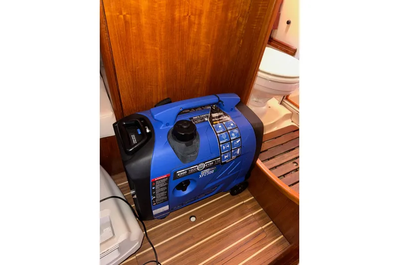 Slide: The Image of Blue portable generator inside a 2005 Hunter 38 sailboat bathroom. - 75