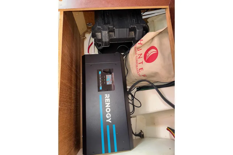 Slide: The Image of Renogy power system in 2005 Hunter 38 boat compartment. - 76