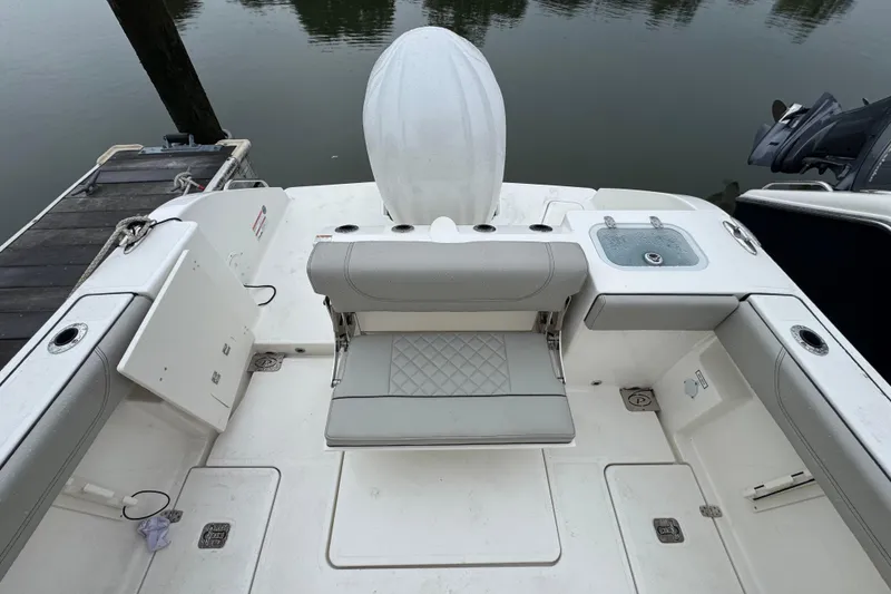 Slide: The Image of 2024 Pursuit S 248 Sport boat interior with seating and storage compartments. - 11