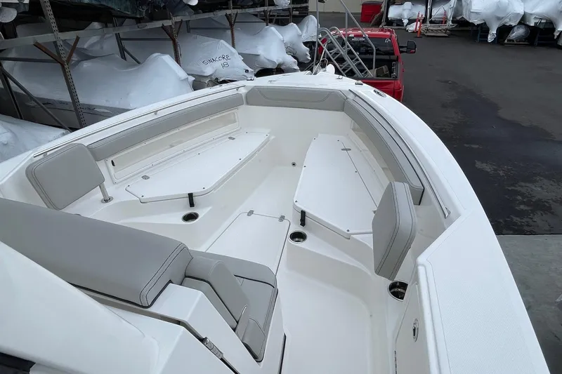 Slide: The Image of 2024 Pursuit S 248 Sport boat interior with spacious seating and modern design. - 15