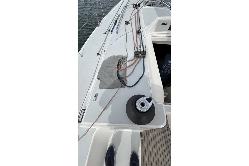 Slide: The Image of 2008 J Boats J/122 deck with winch and ropes, sailing equipment visible. - 17