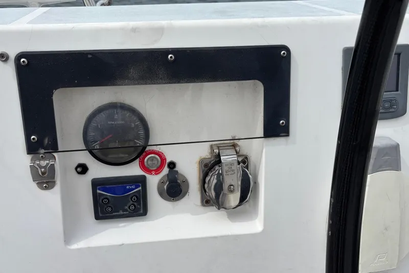 Slide: The Image of Control panel of a 2008 J Boats J/122 sailboat with gauges and switches. - 24