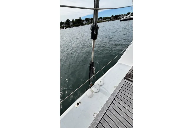 Slide: The Image of 2008 J Boats J/122 deck view with water and shoreline in background. - 27