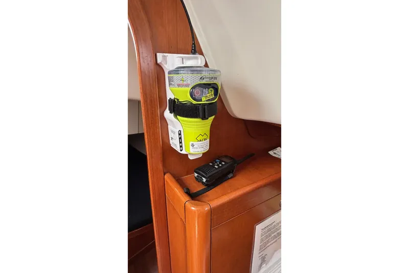 Slide: The Image of Emergency equipment on 2008 J Boats J/122, featuring EPIRB and handheld radio. - 34