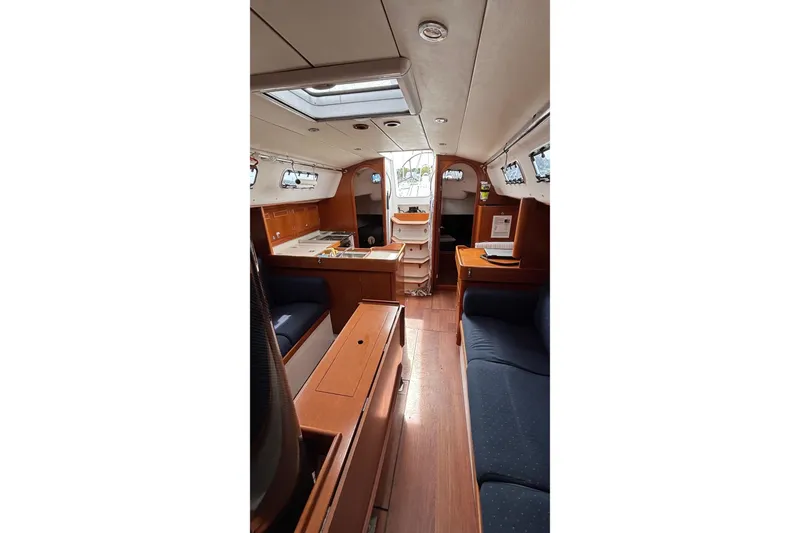 Slide: The Image of Interior of 2008 J Boats J/122 sailboat with wood finish and seating area. - 38
