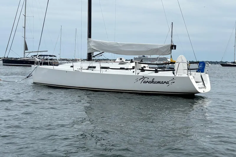 Slide: The Image of 2008 J Boats J/122 sailboat "Tarakumara" moored on calm water. - 4