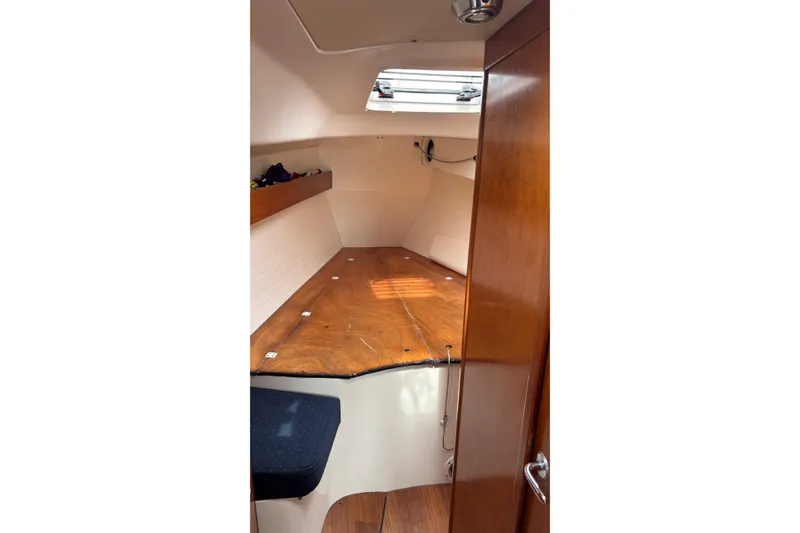 Slide: The Image of 2008 J Boats J/122 cabin interior with wooden finish and overhead hatch. - 42