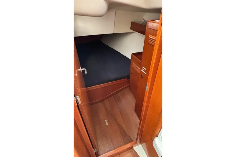 Slide: The Image of Interior cabin of 2008 J Boats J/122, featuring wooden finish and cozy sleeping area. - 45