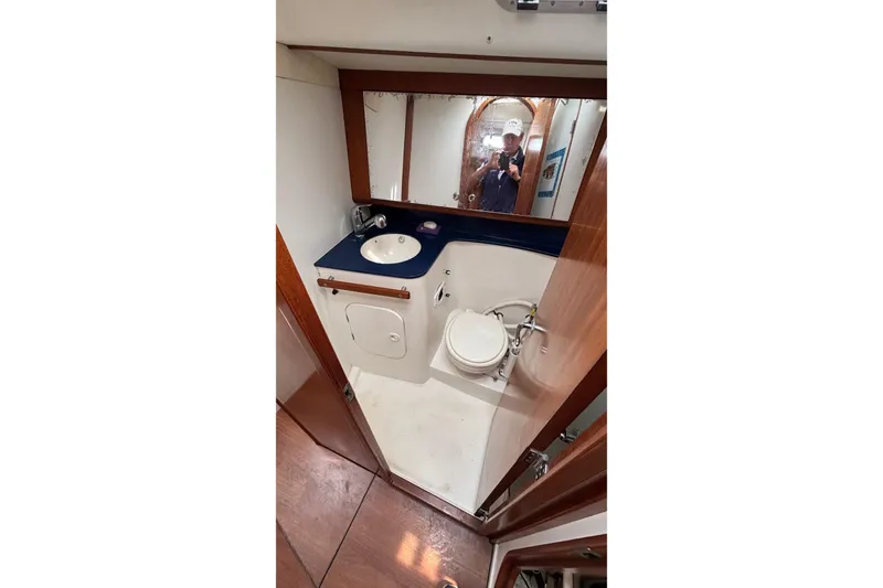 Slide: The Image of Bathroom interior of 2008 J Boats J/122 yacht, featuring sink and toilet. - 47