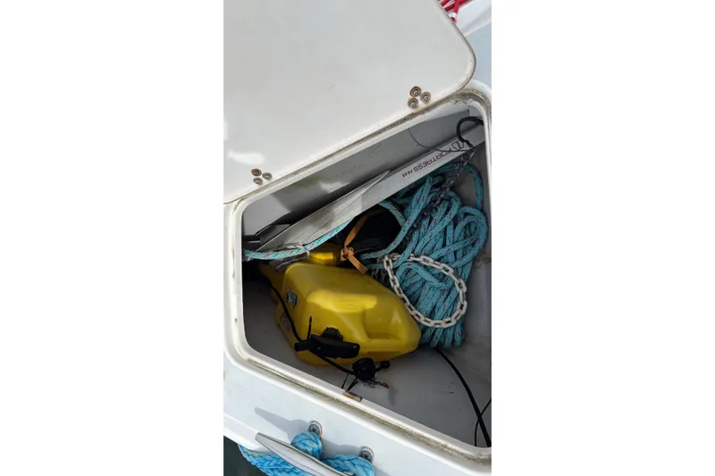 Slide: The Image of Storage compartment on 2008 J Boats J/122 with ropes and yellow container. - 8