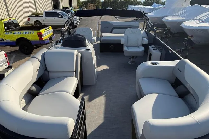 Slide: The Image of 2026 Lowe SS 230 DV pontoon boat with spacious seating and modern design. - 12