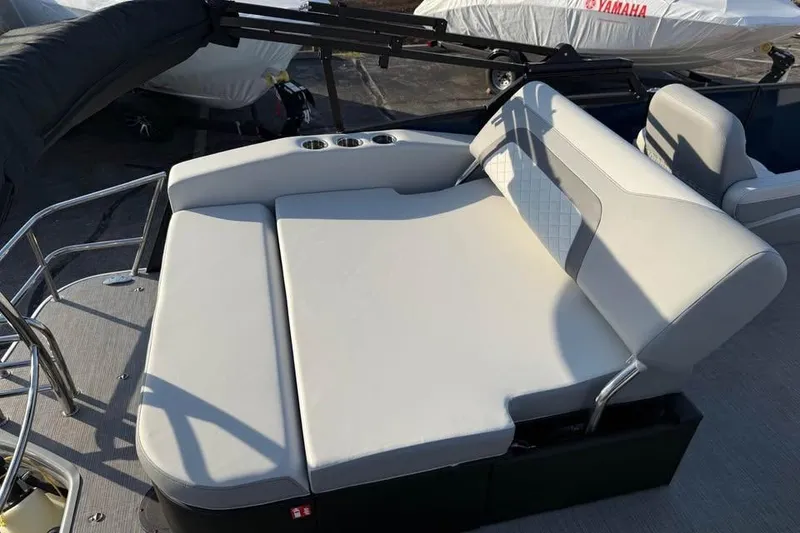 Slide: The Image of 2026 Lowe SS 230 DV boat with comfortable seating and cup holders on deck. - 7