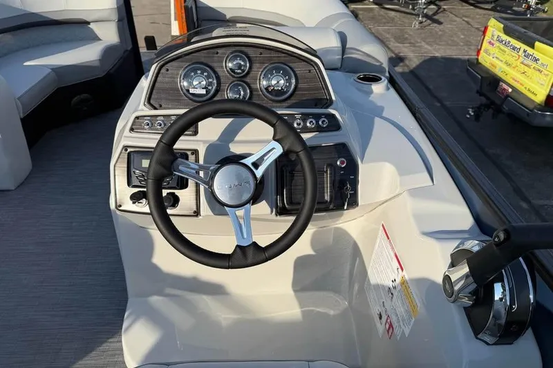 Slide: The Image of Steering console of 2026 Lowe SS 230 DV boat with gauges and controls. - 9
