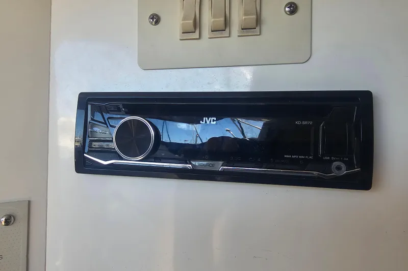 Slide: The Image of JVC stereo system in a 1999 Maxum 2400 SCR boat interior. - 24