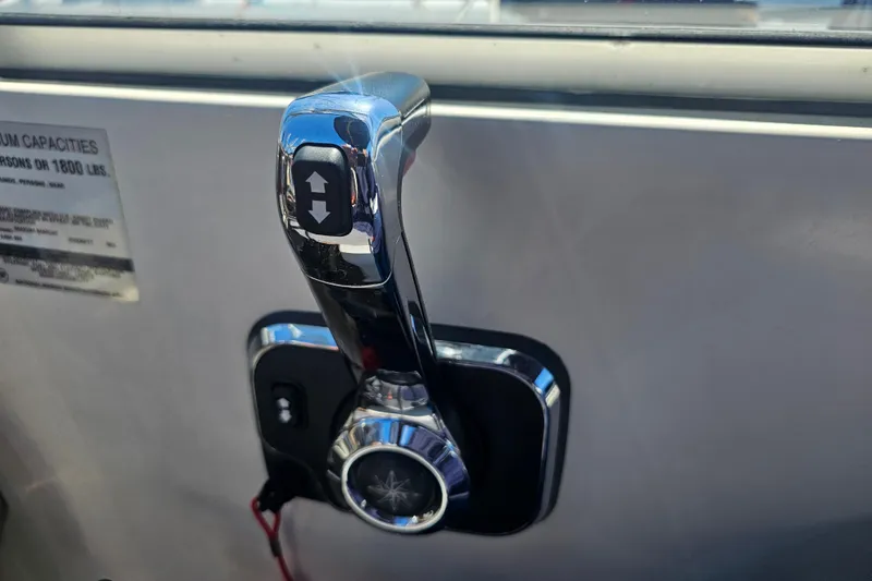 Slide: The Image of Throttle control lever on a 1999 Maxum 2400 SCR boat dashboard. - 5