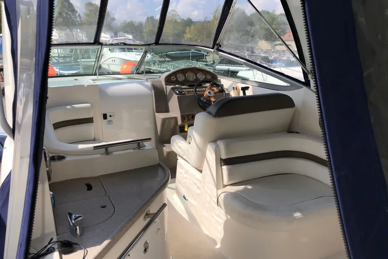 Slide: The Image of 2008 Rinker 260 Express Cruiser interior with helm and seating area. - 3