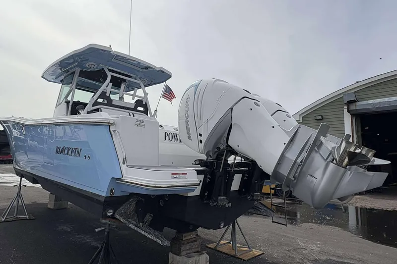 Slide: The Image of 2023 Blackfin 332cc boat with powerful outboard engines on display. - 20