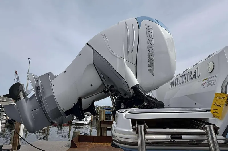 Slide: The Image of 2023 Blackfin 332cc boat with Mercury outboard engine at a marina dock. - 26