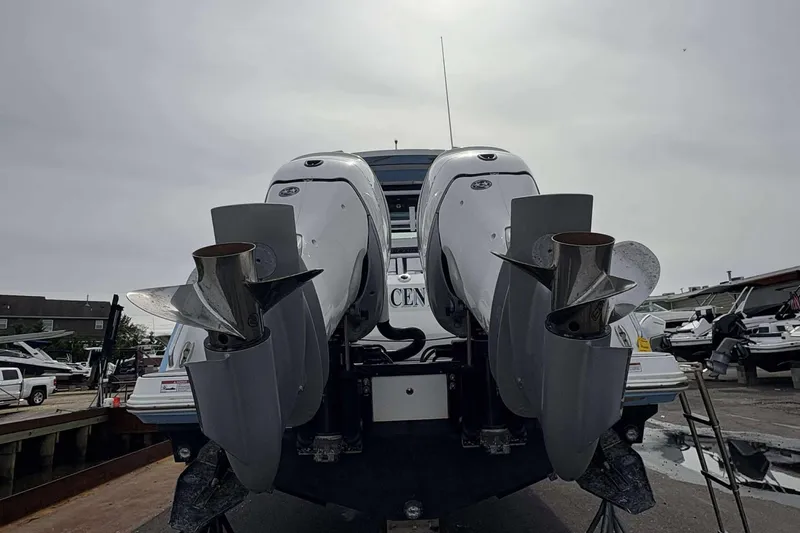 Slide: The Image of 2023 Blackfin 332cc boat with dual outboard engines at a marina. - 27