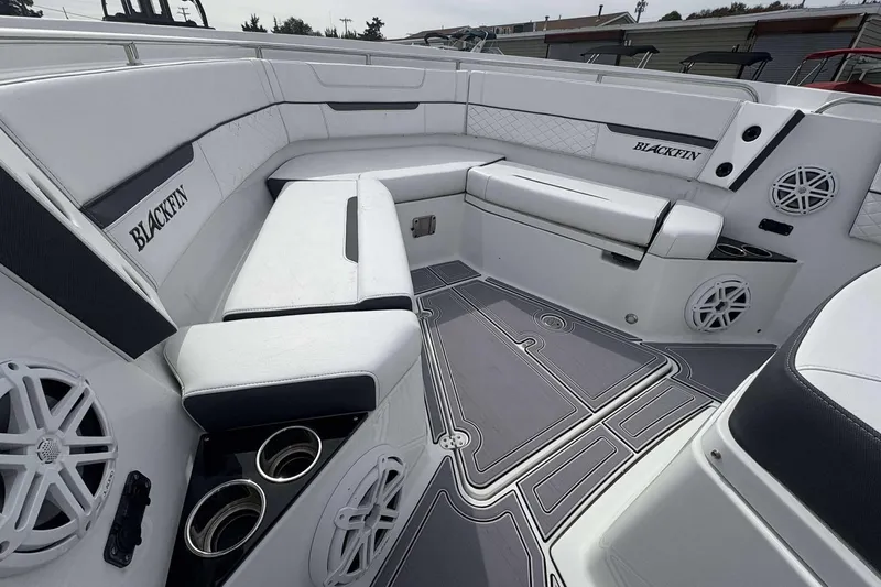 Slide: The Image of 2023 Blackfin 332cc boat interior with white seating and modern design. - 7
