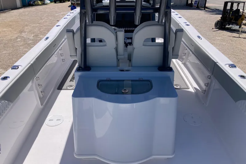 Slide: The Image of 2026 Twin Vee 280 GFX CC boat interior with seating and storage features. - 5