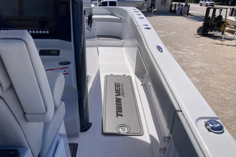 Slide: The Image of 2026 Twin Vee 280 GFX CC boat interior, featuring sleek design and modern controls. - 7