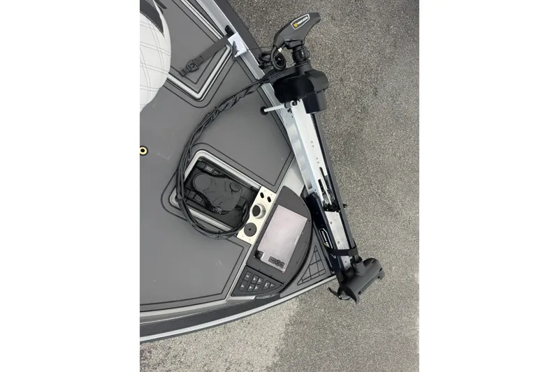 Slide: The Image of 2026 Caymas XS 20 Pro boat deck with trolling motor and control panel. - 11