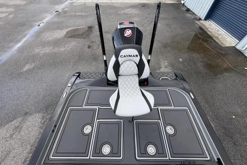 Slide: The Image of 2026 Caymas XS 20 Pro boat deck with seat and storage compartments. - 16