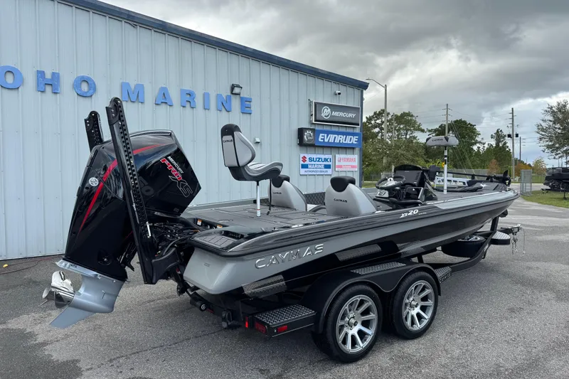 Slide: The Image of 2026 Caymas XS 20 Pro boat at dealership, featuring sleek design and powerful engine. - 2