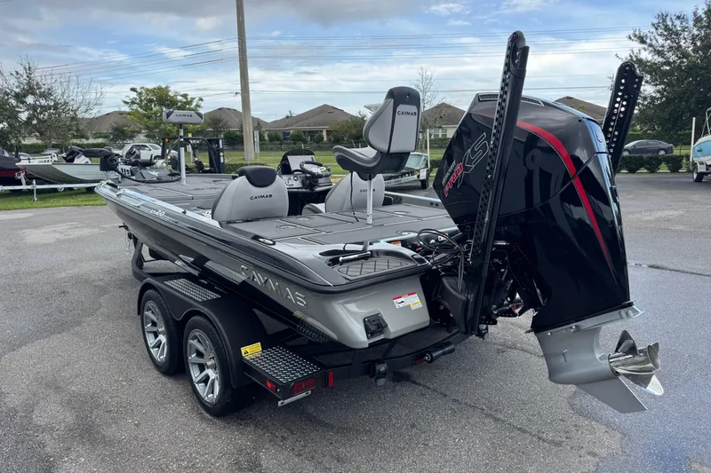 Slide: The Image of 2026 Caymas XS 20 Pro boat with powerful engine, parked on a trailer. - 9