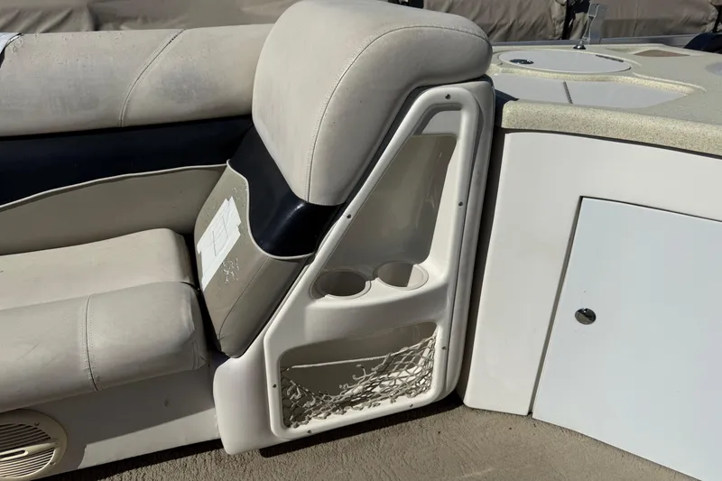 Slide: The Image of 2005 Harris FloteBote 270 Crowne boat interior with seating and storage compartments. - 12