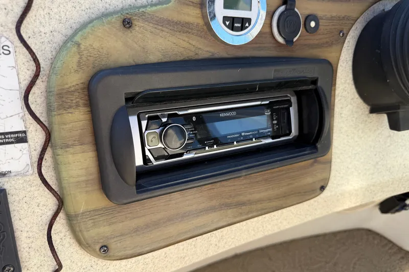 Slide: The Image of Kenwood stereo system on 2005 Harris FloteBote 270 Crowne boat dashboard. - 16