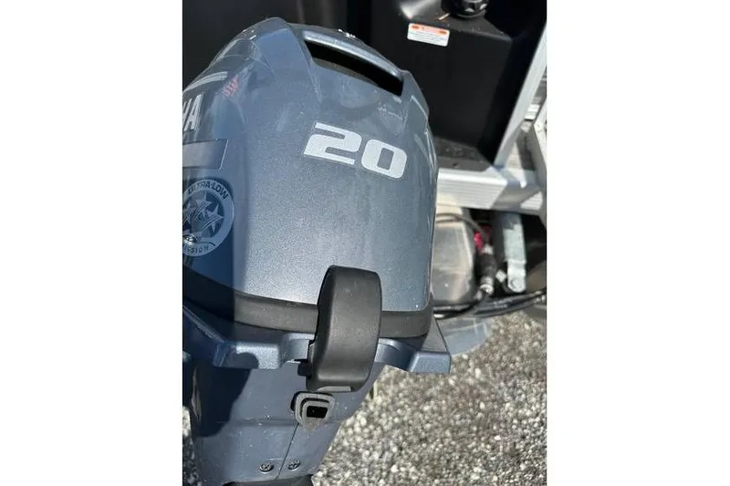 Slide: The Image of 2025 Bennington 20 SF Family boat engine close-up, showcasing Yamaha motor details. - 5