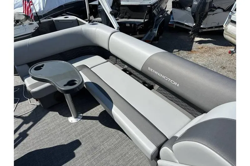 Slide: The Image of 2025 Bennington 20 SF Family boat with gray seating and a small table. - 6