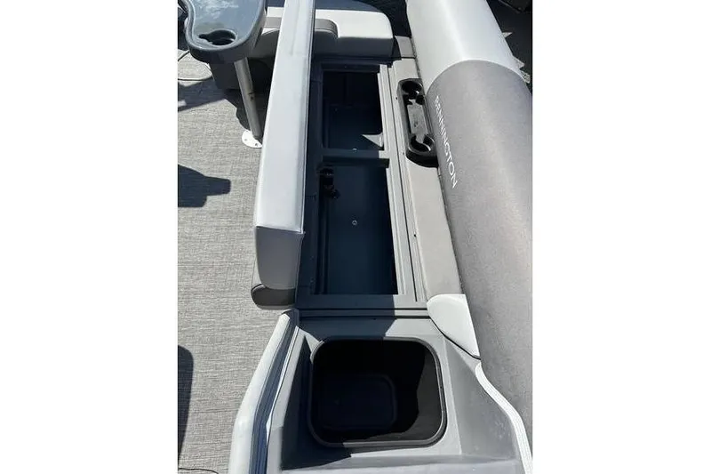 Slide: The Image of 2025 Bennington 20 SF Family boat interior with storage compartments and seating. - 7