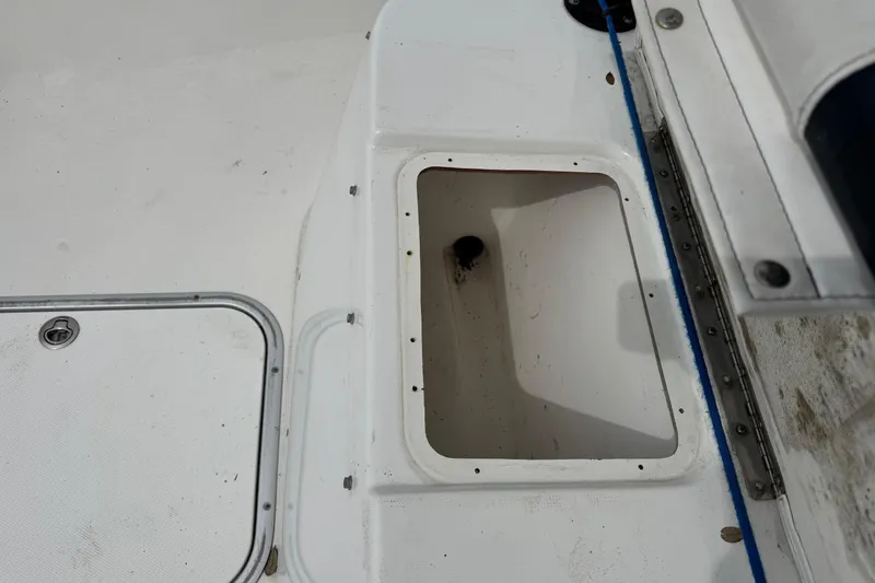 Slide: The Image of 2018 Cape Horn 27 boat interior showing storage compartment and deck details. - 13