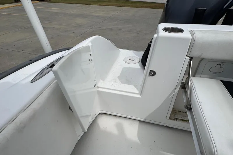 Slide: The Image of 2018 Cape Horn 27 boat interior with open storage compartment and seating area. - 21