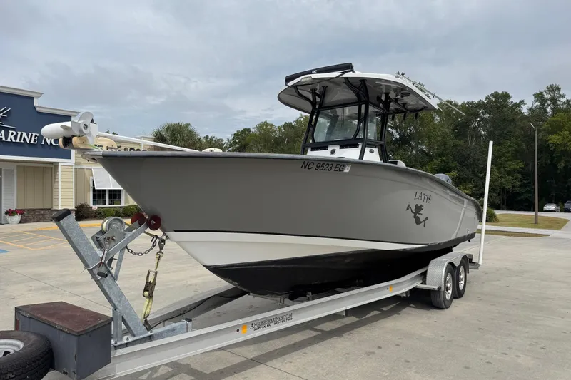 The Image of 2018 Cape Horn 27 boat on trailer outside marine store. - 1