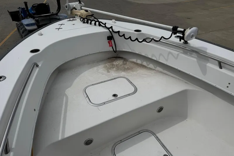 Slide: The Image of 2018 Cape Horn 27 boat deck with storage hatch and trolling motor. - 10