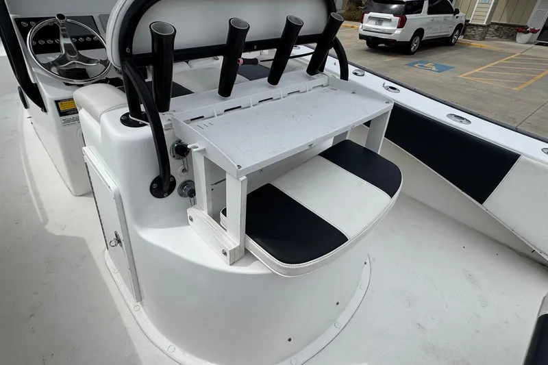 Slide: The Image of 2018 Cape Horn 27 boat interior with rod holders and seating. - 19