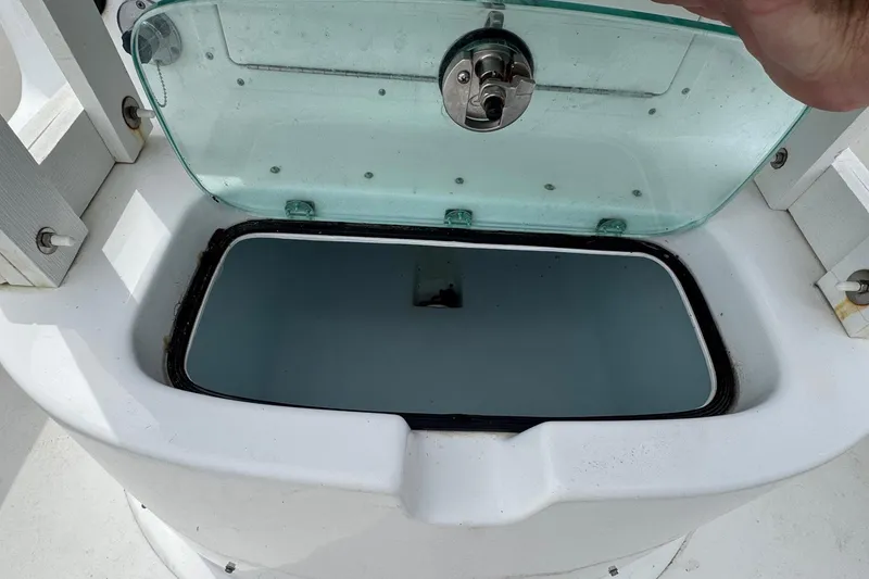 Slide: The Image of Open storage compartment on 2018 Cape Horn 27 boat with transparent lid. - 20