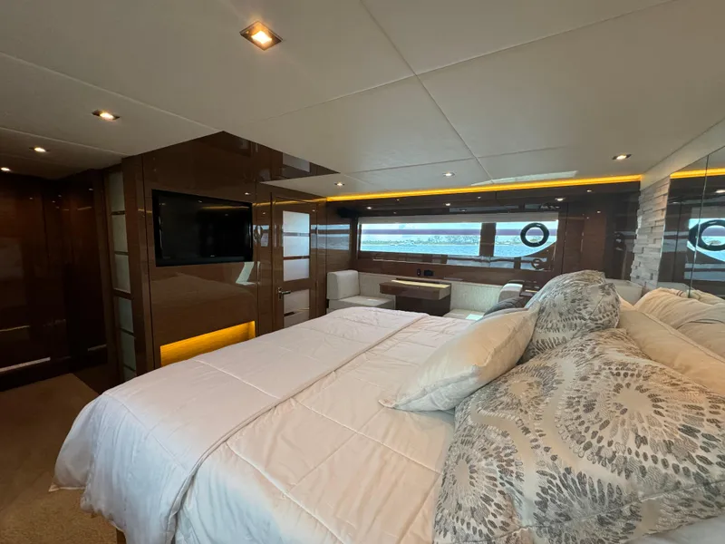 Slide: The Image of Luxurious bedroom interior of 2021 Cruisers Yachts 60 Cantius Flybridge with modern amenities. - 29