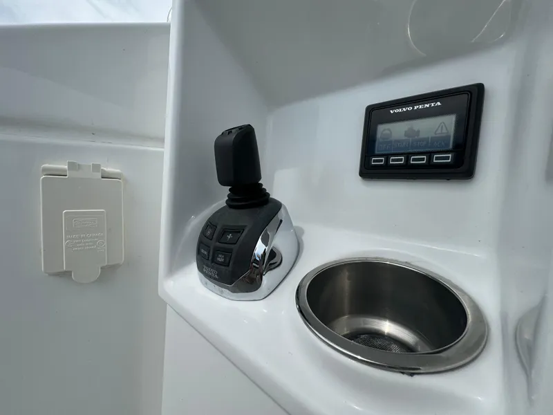 Slide: The Image of Cruisers Yachts 60 Cantius Flybridge 2021 control panel with joystick and display. - 43