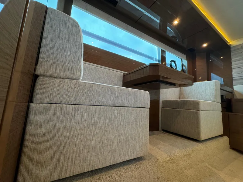 Slide: The Image of Luxurious interior of 2021 Cruisers Yachts 60 Cantius Flybridge with plush seating. - 31