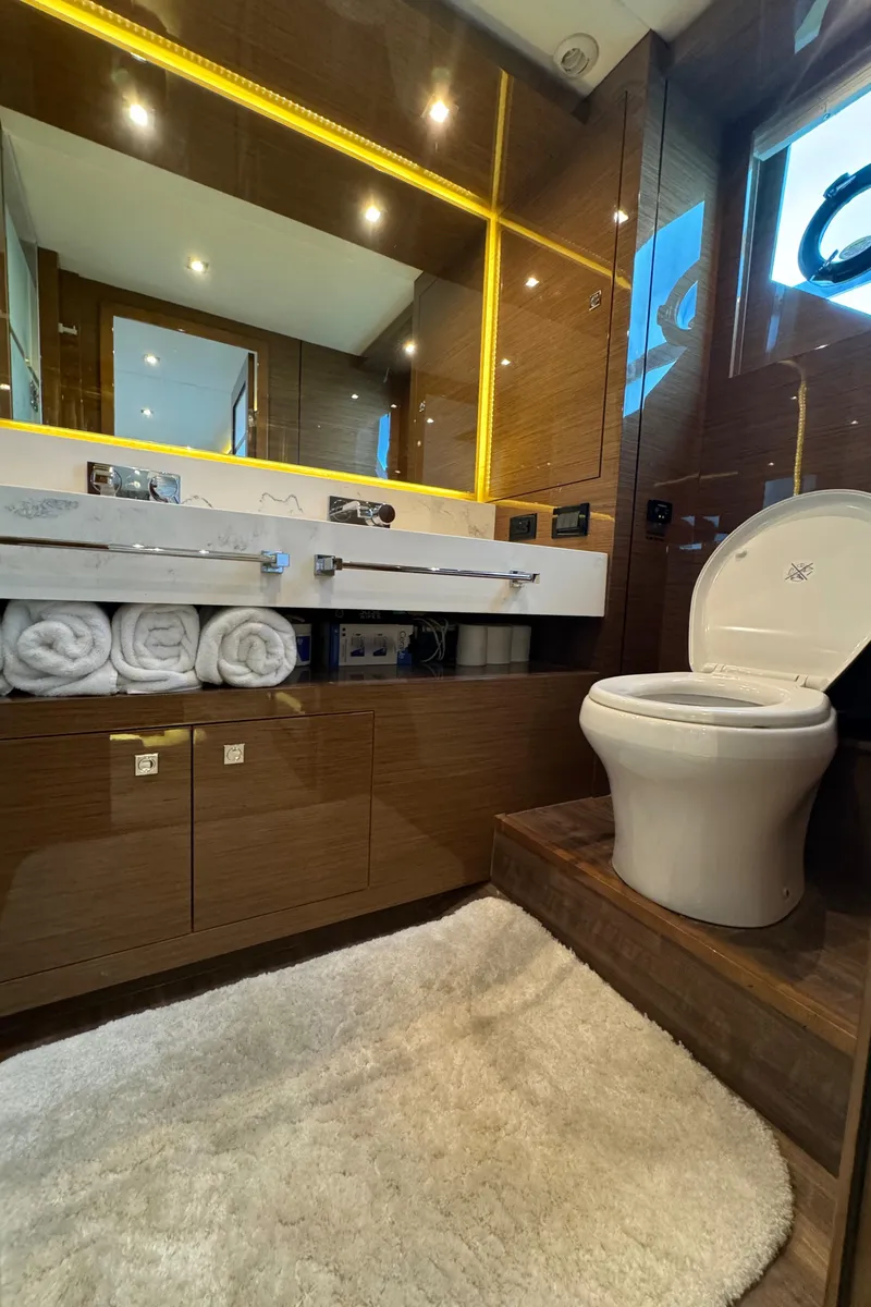 Slide: The Image of Luxurious bathroom in 2021 Cruisers Yachts 60 Cantius Flybridge, featuring modern fixtures and elegant design. - 32